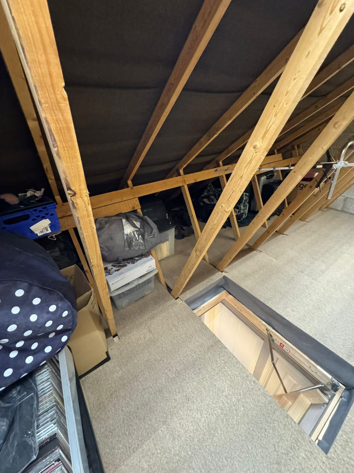 Boarded loft used for family storage in Essex