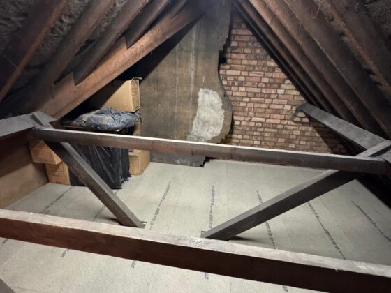 Raised loft boarding fitted over full-depth insulation