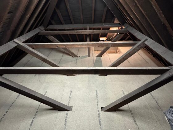 Raised loft boarding fitted over full-depth insulation