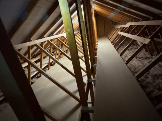 Raised loft boarding fitted over full-depth insulation