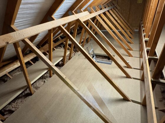 Raised loft boarding fitted over full-depth insulation
