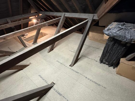 Raised loft boarding fitted over full-depth insulation