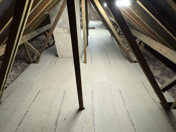 Raised loft boarding fitted over full-depth insulation