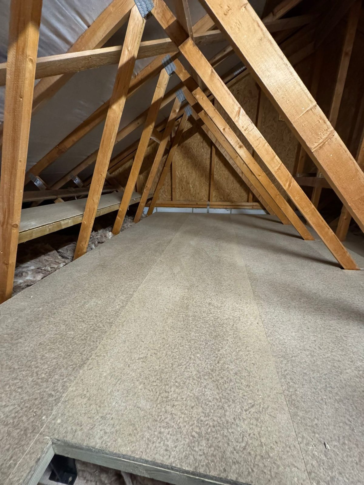 Loft boarded end to end over full-depth insulation