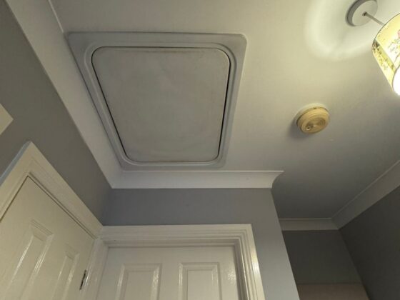 Insulated loft hatch finished flush with the ceiling